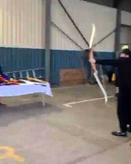 An archer at full draw in the akhara.